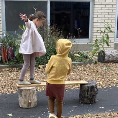 Child on a balance beam made out of wood